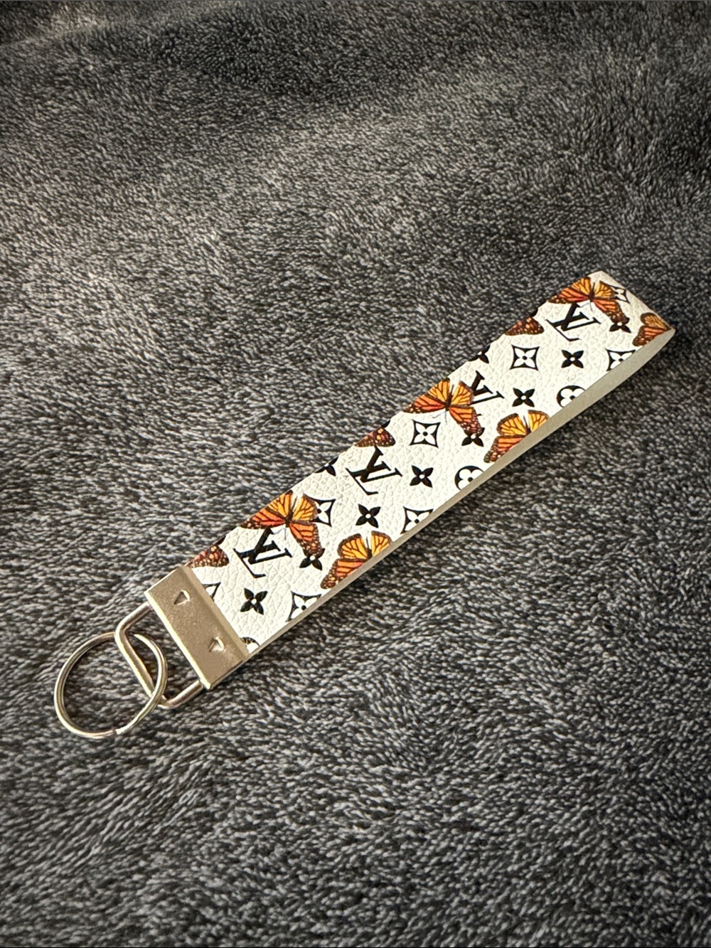 Designer White Wristlet with Orange Butterfly Motif